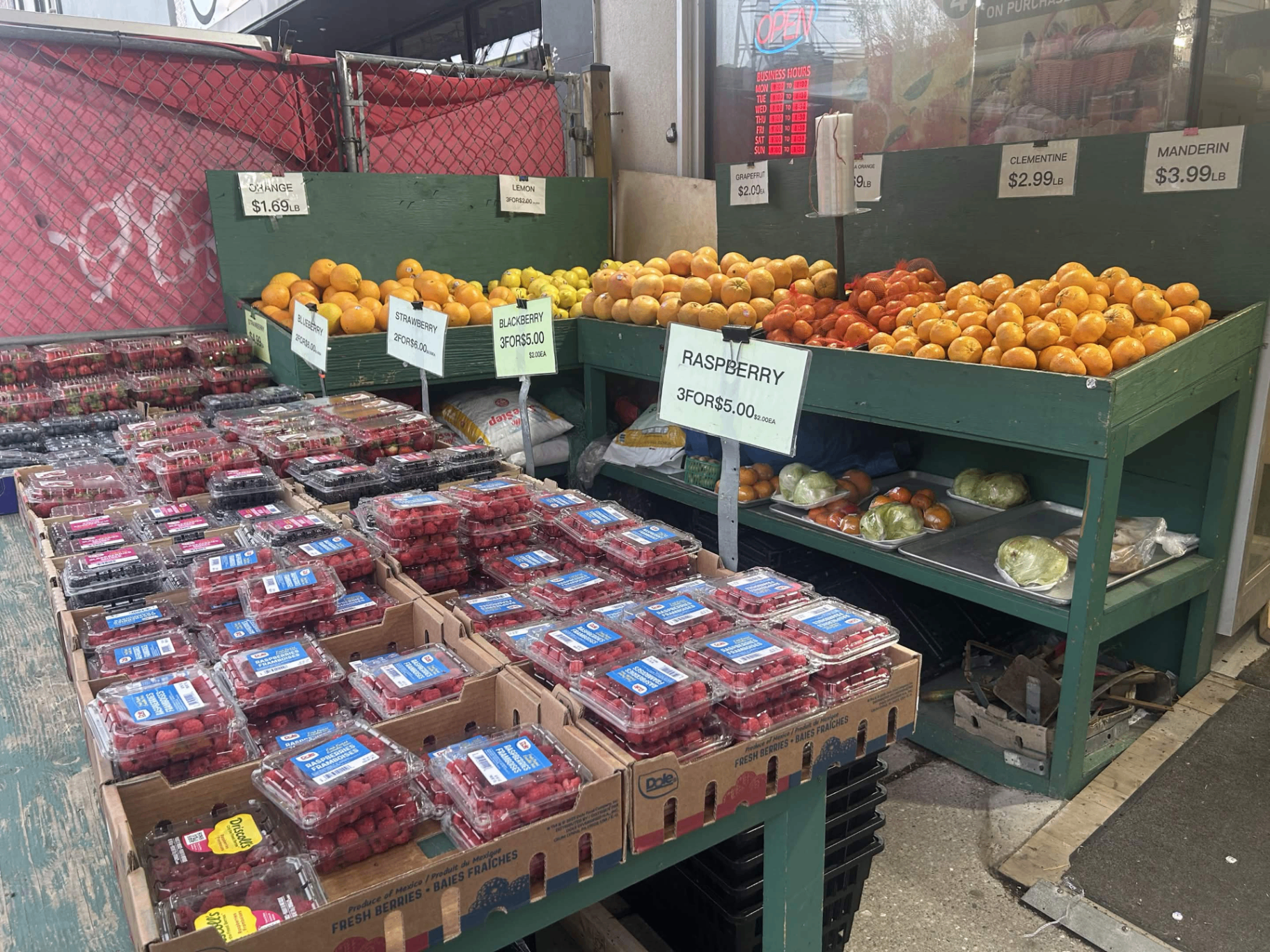 Fresh berries and citrus on display outside Fruitland