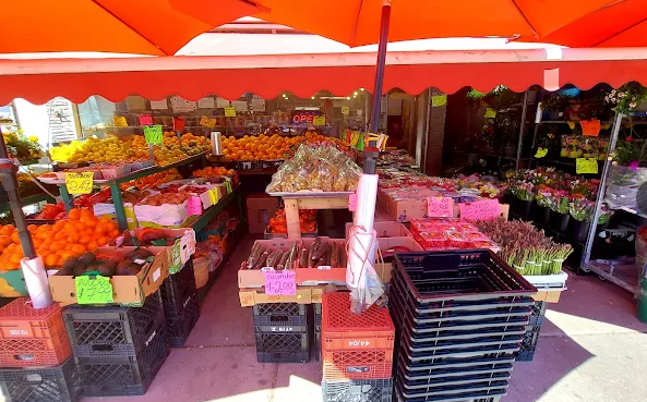 Fresh produce and flowers on display outside Fruitland